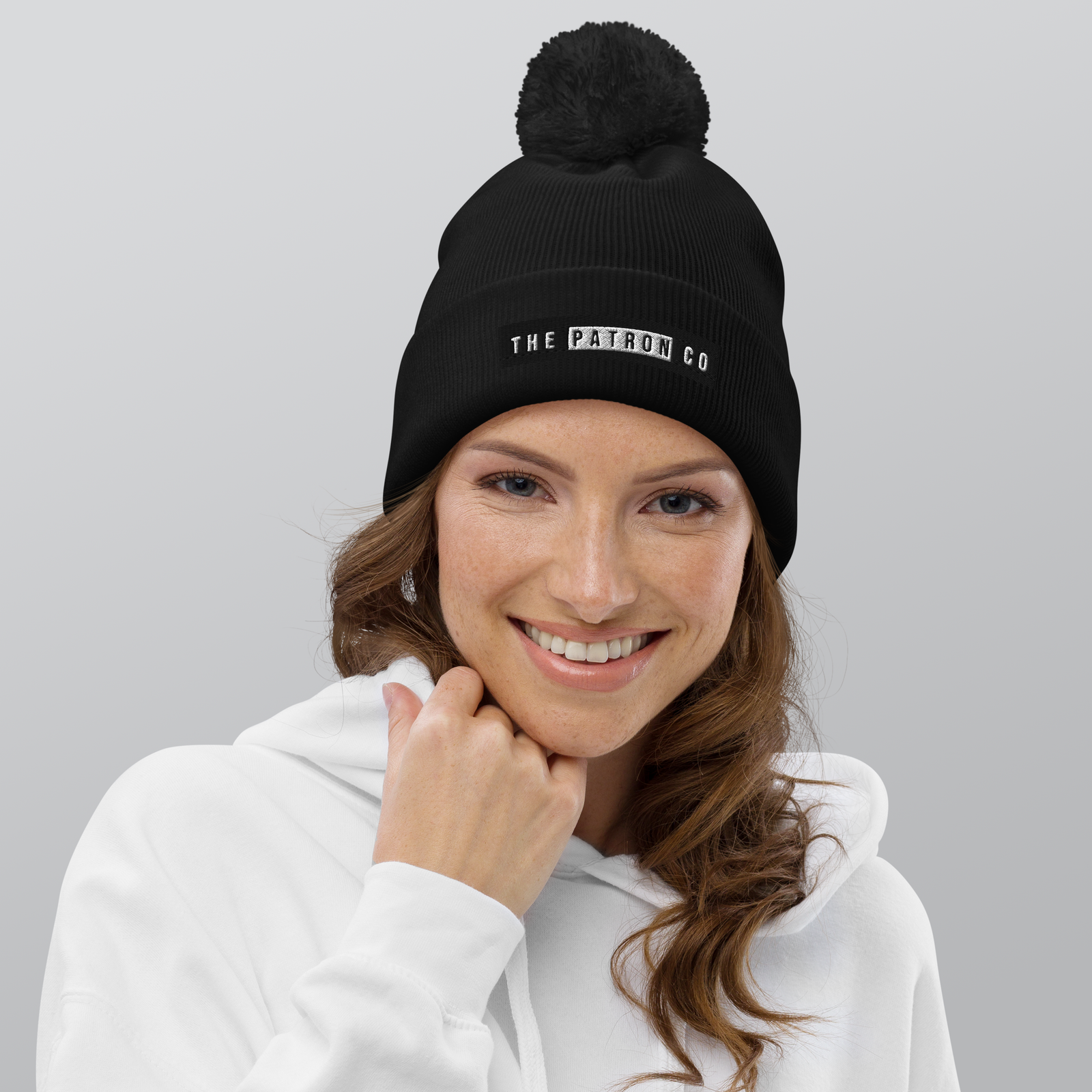 pom-pom-beanie-black-front-65a18a95a39b5