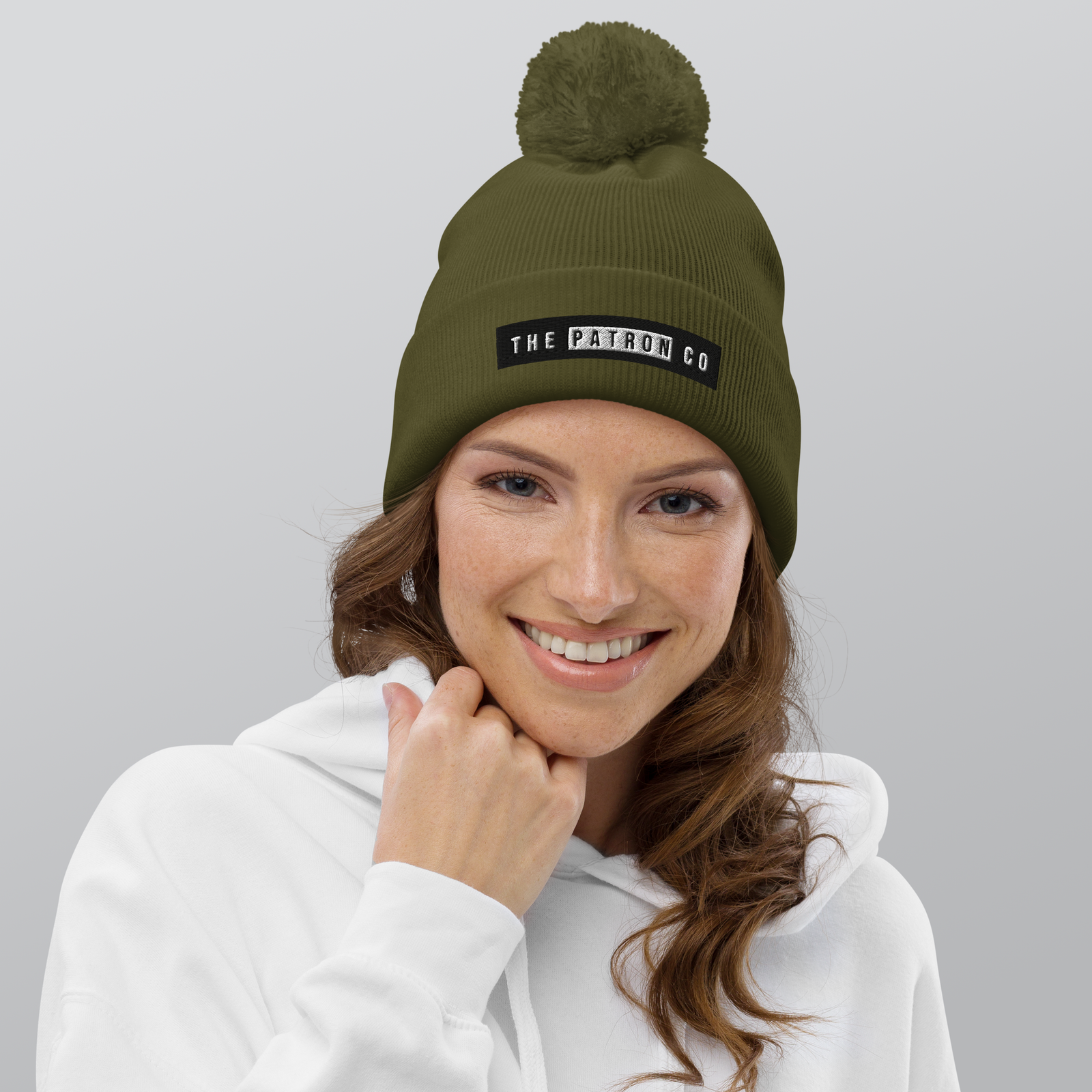 pom-pom-beanie-moss-green-front-65a18a95ca774